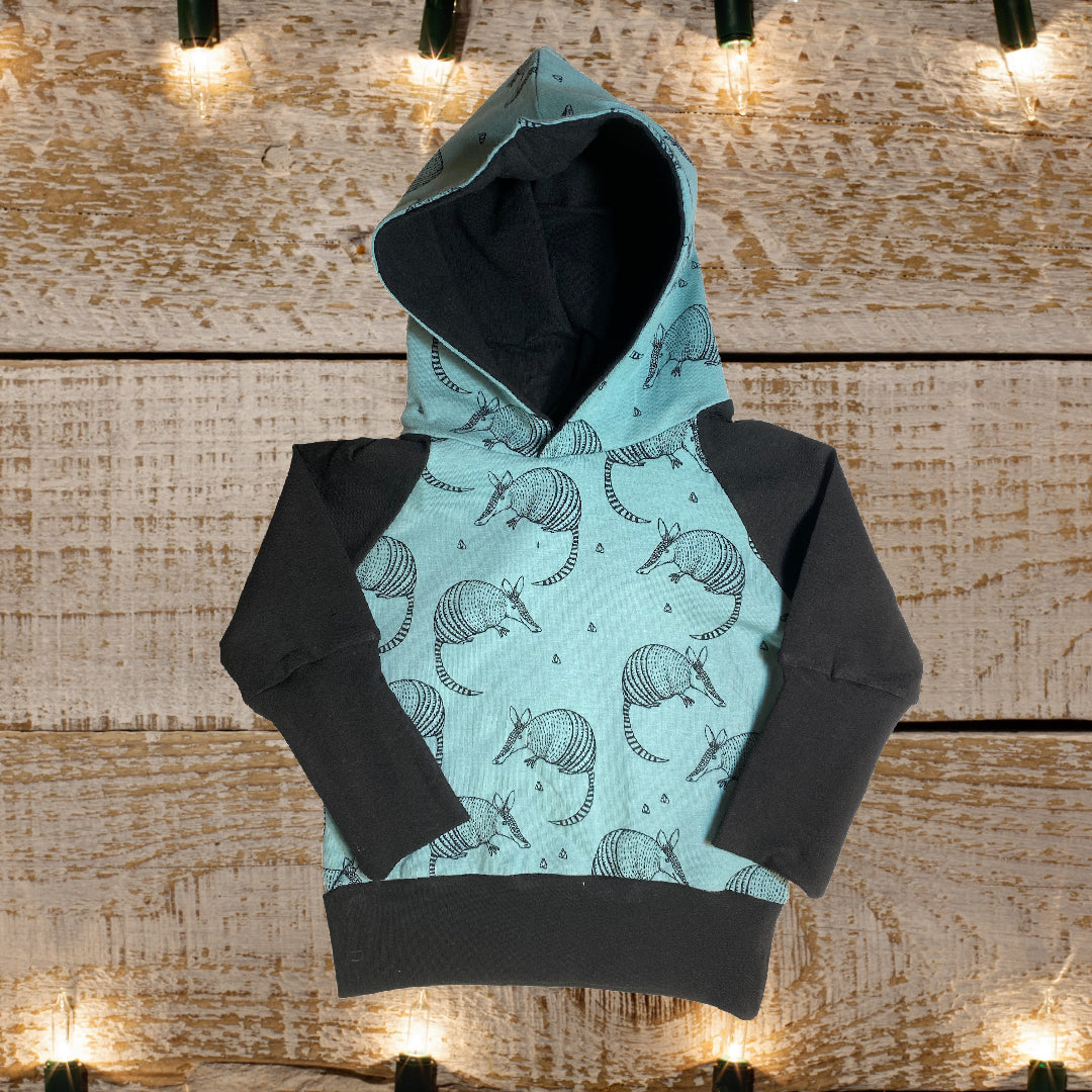 Armadillo Teal Negro Género Neutral Algodón Orgánico Grow Along Babywear® Suéter con capucha