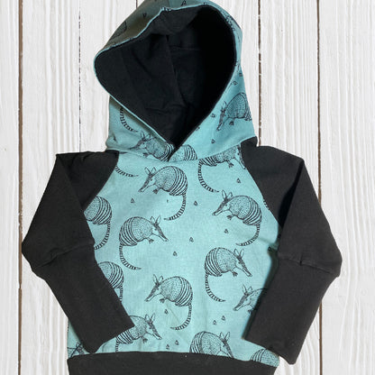 Armadillo Teal Negro Género Neutral Algodón Orgánico Grow Along Babywear® Suéter con capucha