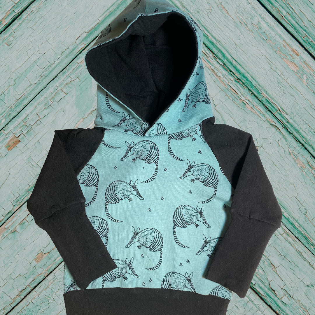 Armadillo Teal Negro Género Neutral Algodón Orgánico Grow Along Babywear® Suéter con capucha